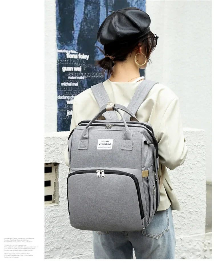 gris sac a dos langer lit bebe dos